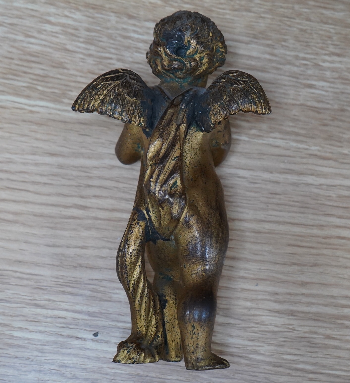 A 19th century ormolu ‘cherub’ mount, 16cm. Condition - worn